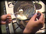 Dunking the marshmallows in melted chocolate